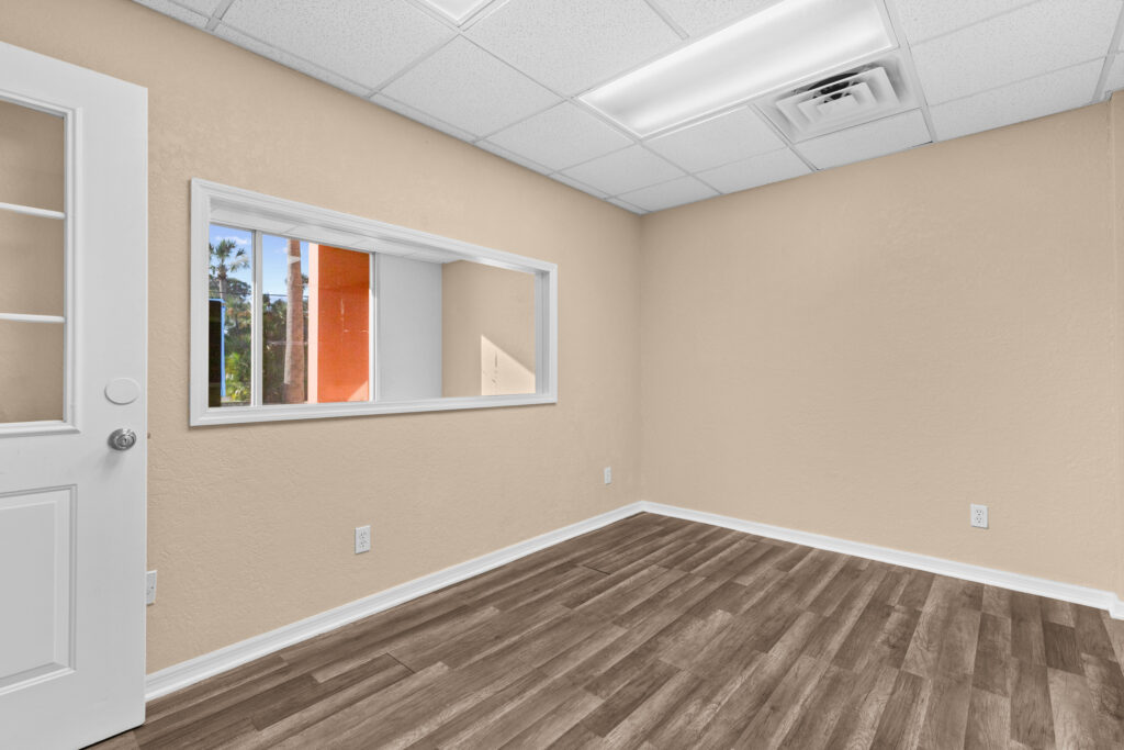 Photo of a commercial space for rent in Merritt Island, Florida at 2460 North Courtenay Parkway in 103 in Merritt Island, Florida. Call Perrone Properties at 321-454-3393 for more information unit 103 at Perrone Plaza.