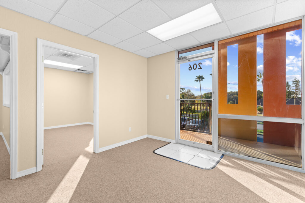 Photo of a commercial space for rent in Merritt Island, Florida at 2460 North Courtenay Parkway in 206 in Merritt Island, Florida. Call Perrone Properties at 321-454-3393 for more information unit 206 at Perrone Plaza.
