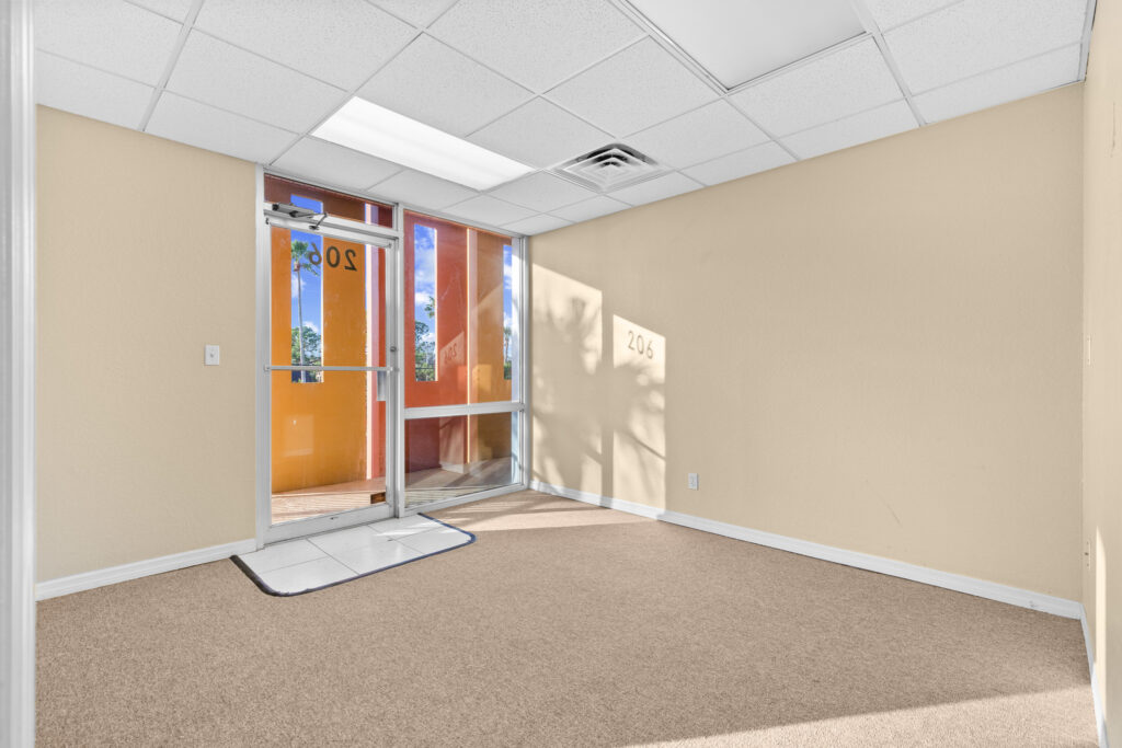 Photo of a commercial space for rent in Merritt Island, Florida at 2460 North Courtenay Parkway in 206 in Merritt Island, Florida. Call Perrone Properties at 321-454-3393 for more information unit 206 at Perrone Plaza.