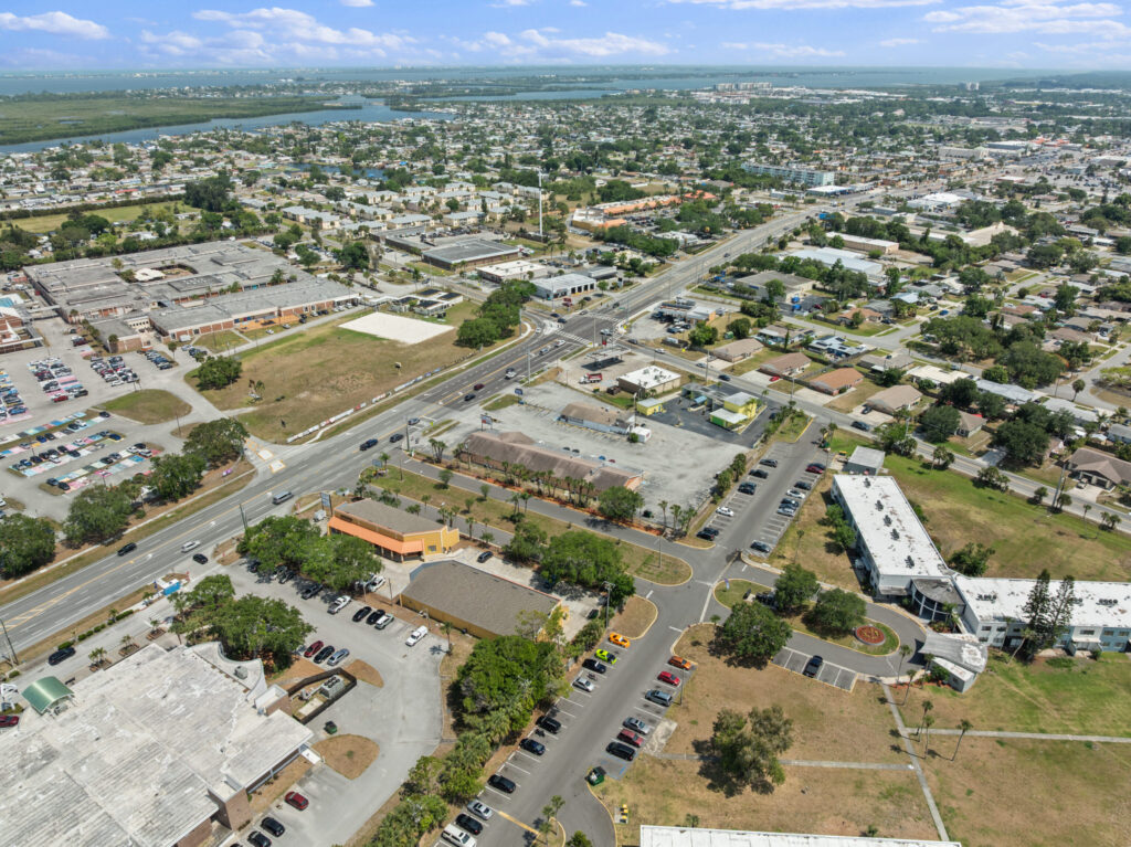 An aerial view of the Perrone Village buildings at 1175 North Courtenay Parkway in Merritt Island, Florida.
