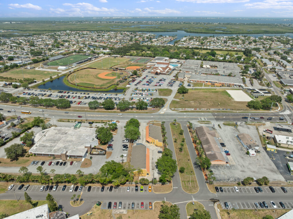 An aerial view of the Perrone Village buildings at 1175 North Courtenay Parkway in Merritt Island, Florida.