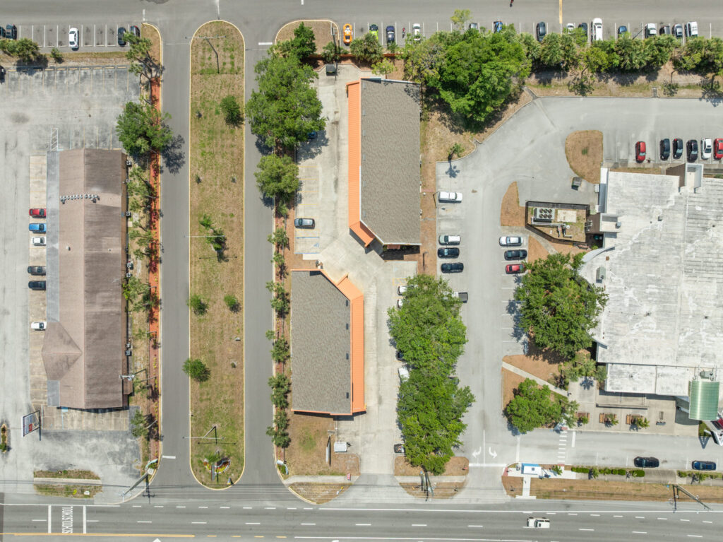 An aerial view of the Perrone Village buildings at 1175 North Courtenay Parkway in Merritt Island, Florida.