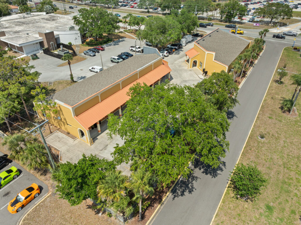 An aerial view of the Perrone Village buildings at 1175 North Courtenay Parkway in Merritt Island, Florida.