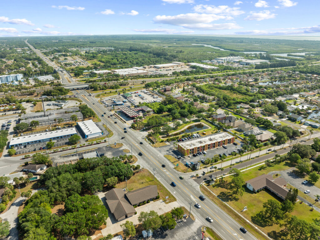An aerial view of the Perrone Plaza building located at 2460 North Courtney Parkway in Merritt Island, Florida.