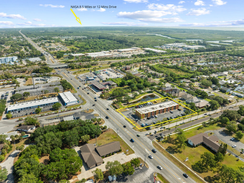 An aerial view of the Perrone Plaza building located at 2460 North Courtney Parkway in Merritt Island, Florida.