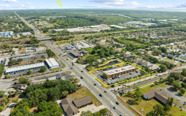 An aerial view of the Perrone Plaza building located at 2460 North Courtney Parkway in Merritt Island, Florida.