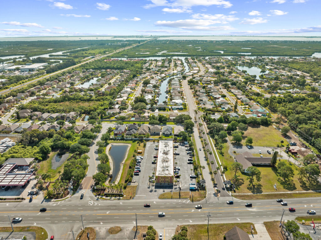 An aerial view of the Perrone Plaza building located at 2460 North Courtney Parkway in Merritt Island, Florida.