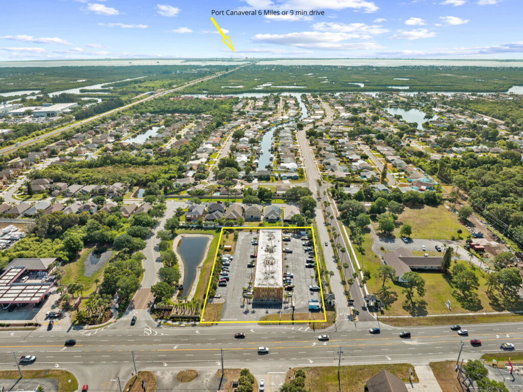 An aerial view of the Perrone Plaza building located at 2460 North Courtney Parkway in Merritt Island, Florida.