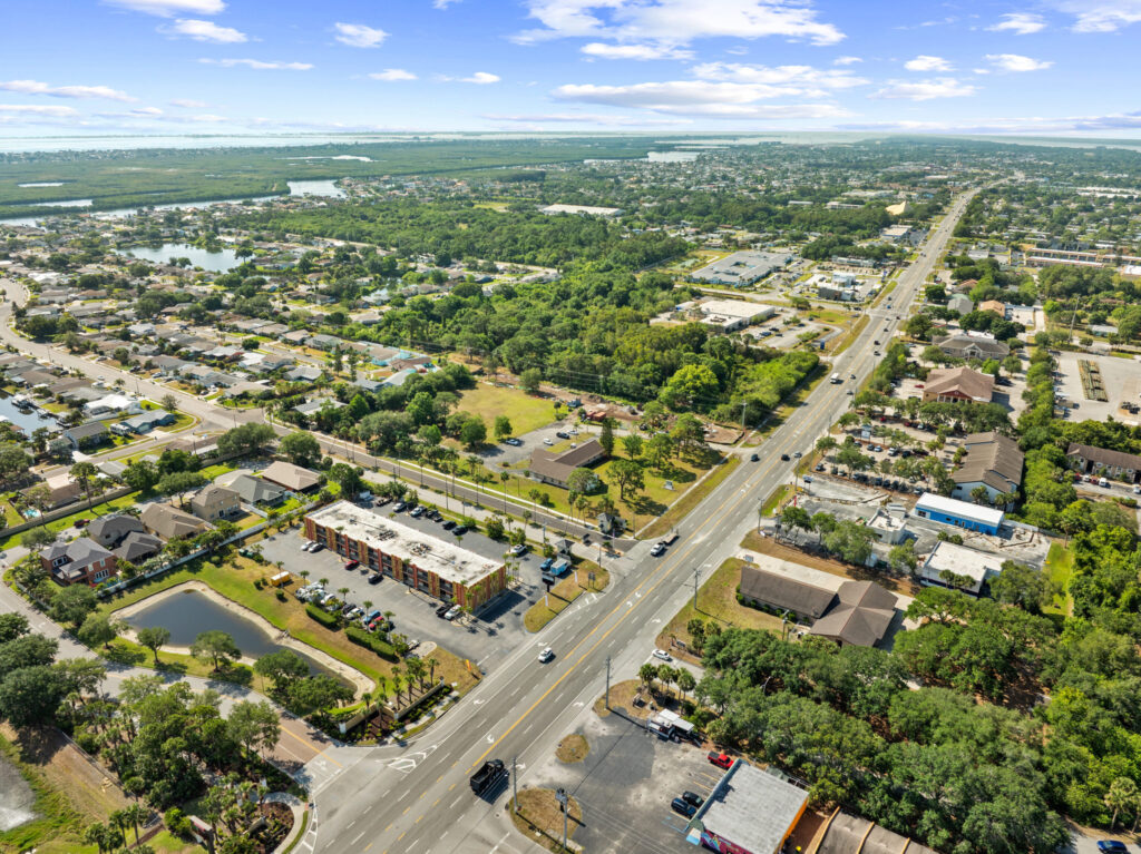 An aerial view of the Perrone Plaza building located at 2460 North Courtney Parkway in Merritt Island, Florida.