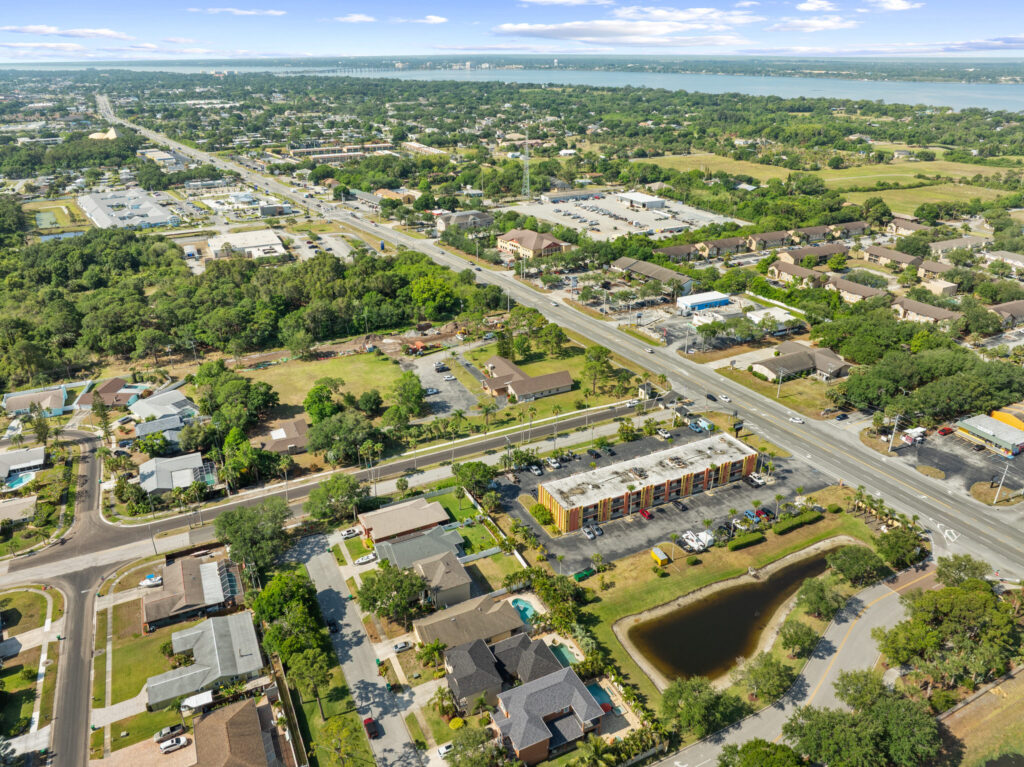 An aerial view of the Perrone Plaza building located at 2460 North Courtney Parkway in Merritt Island, Florida.