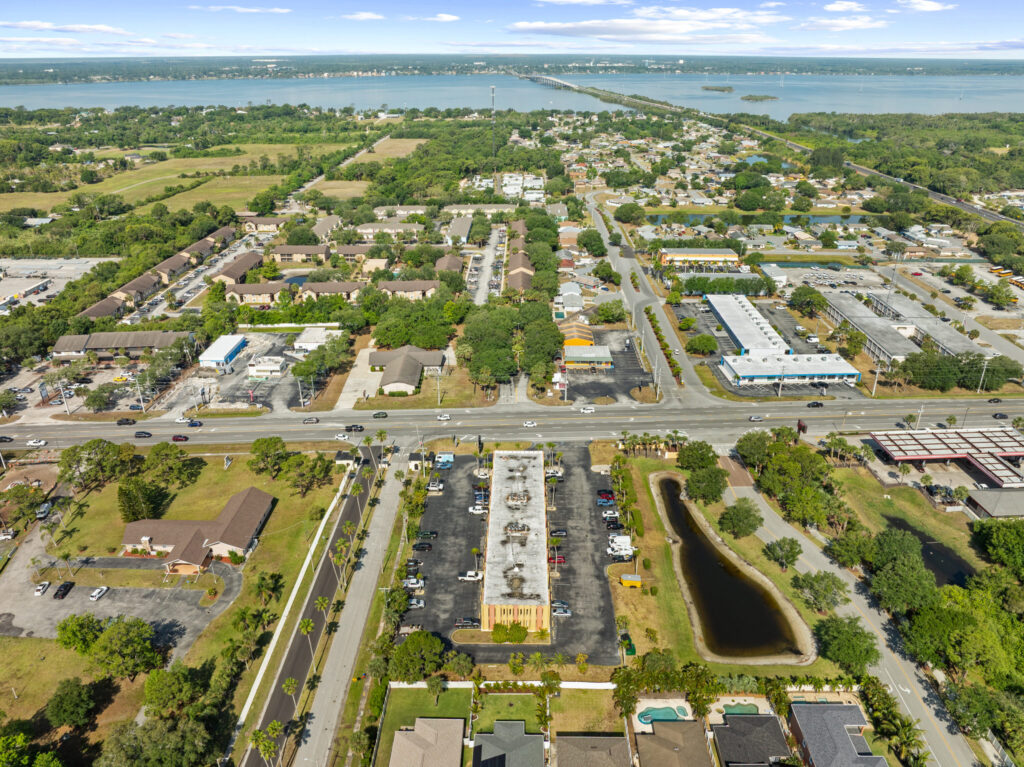 An aerial view of the Perrone Plaza building located at 2460 North Courtney Parkway in Merritt Island, Florida.