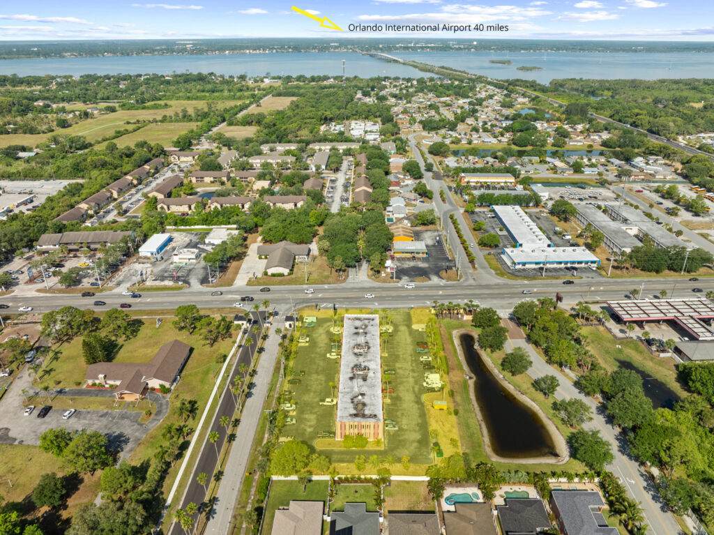 An aerial view of the Perrone Plaza building located at 2460 North Courtney Parkway in Merritt Island, Florida.