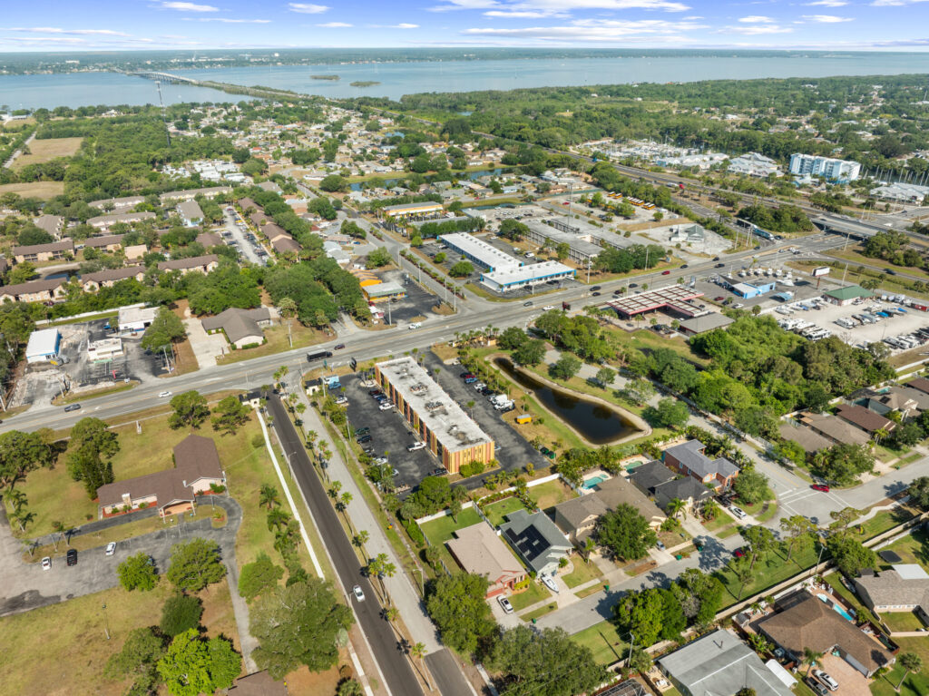 An aerial view of the Perrone Plaza building located at 2460 North Courtney Parkway in Merritt Island, Florida.