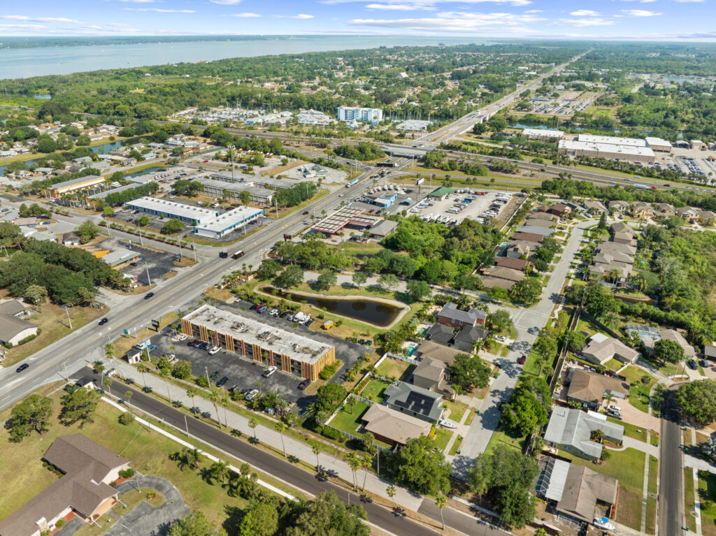 An aerial view of the Perrone Plaza building located at 2460 North Courtney Parkway in Merritt Island, Florida.