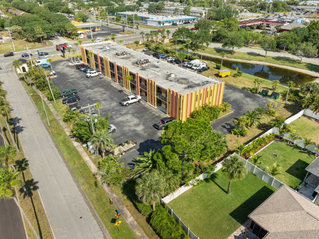 An aerial view of the Perrone Plaza building located at 2460 North Courtney Parkway in Merritt Island, Florida.