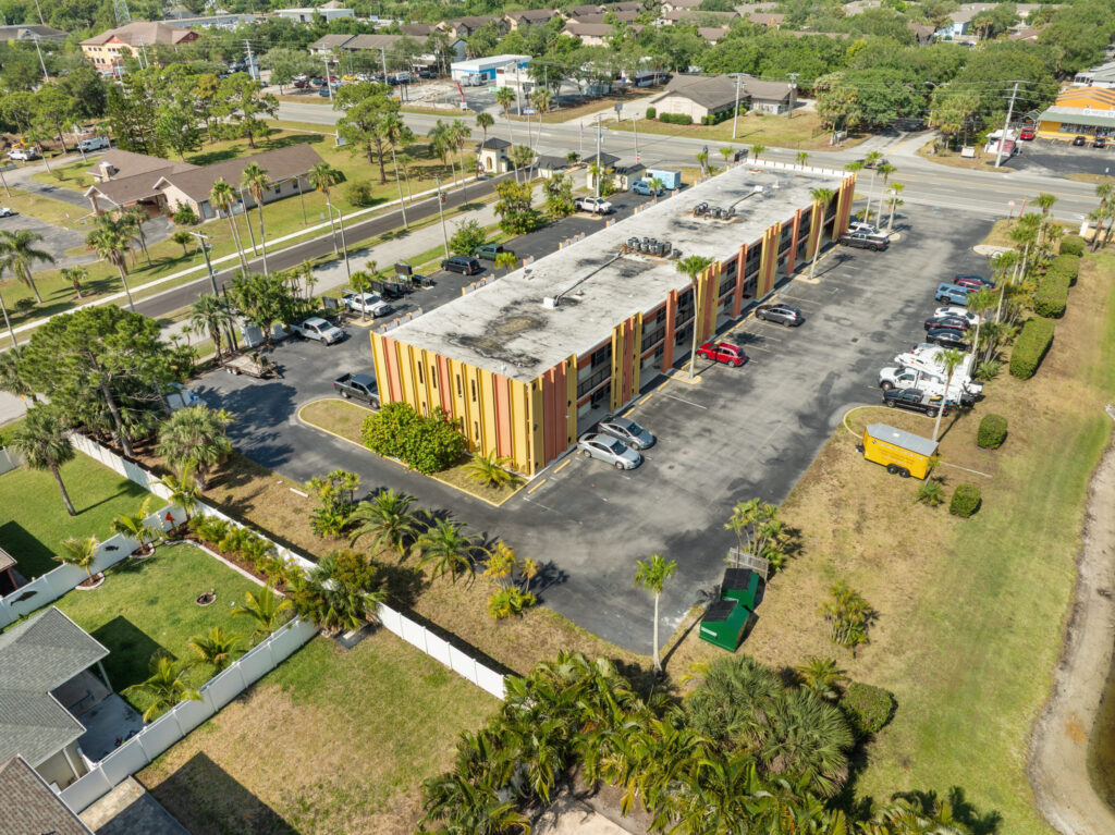 An aerial view of the Perrone Plaza building located at 2460 North Courtney Parkway in Merritt Island, Florida.