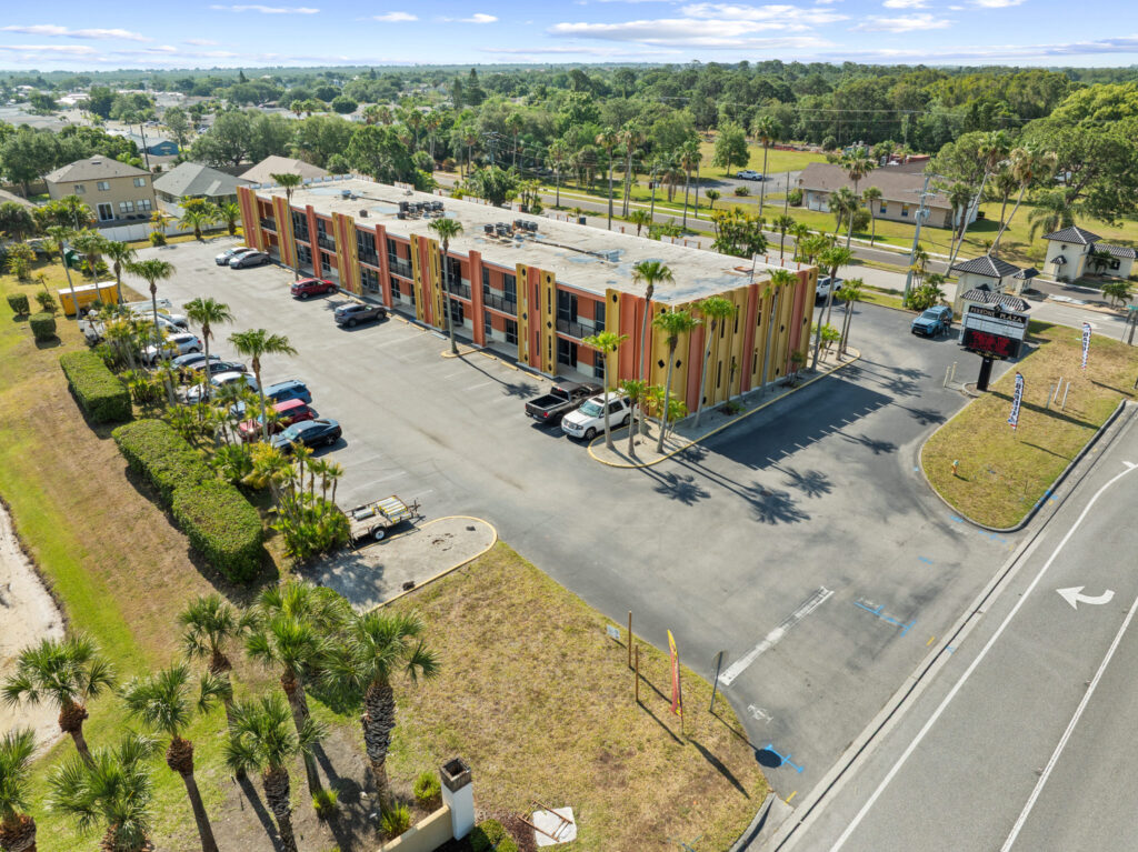 An aerial view of the Perrone Plaza building located at 2460 North Courtney Parkway in Merritt Island, Florida.