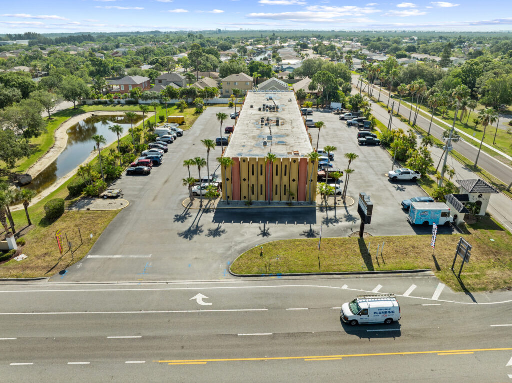 An aerial view of the Perrone Plaza building located at 2460 North Courtney Parkway in Merritt Island, Florida.