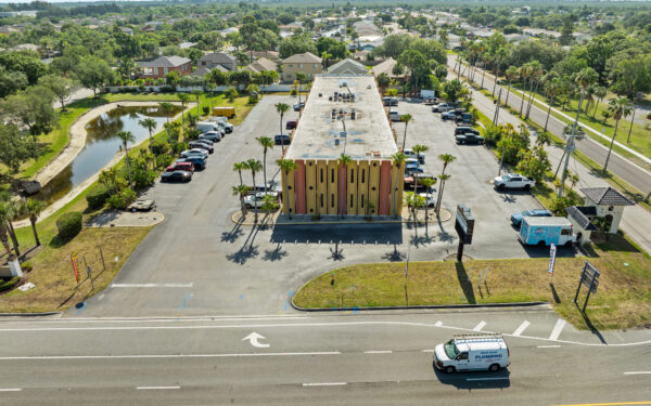 An aerial view of the Perrone Plaza building located at 2460 North Courtney Parkway in Merritt Island, Florida.