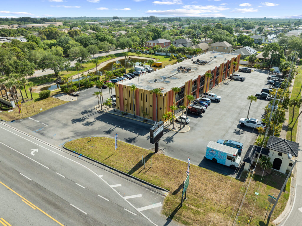 An aerial view of the Perrone Plaza building located at 2460 North Courtney Parkway in Merritt Island, Florida.